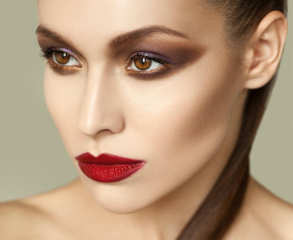 woman with smoky eyeshadow and deep red lipstick