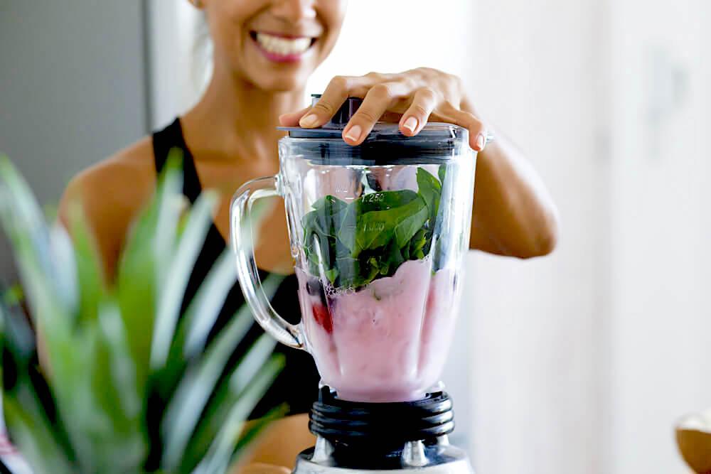 Woman making healthy smoothie