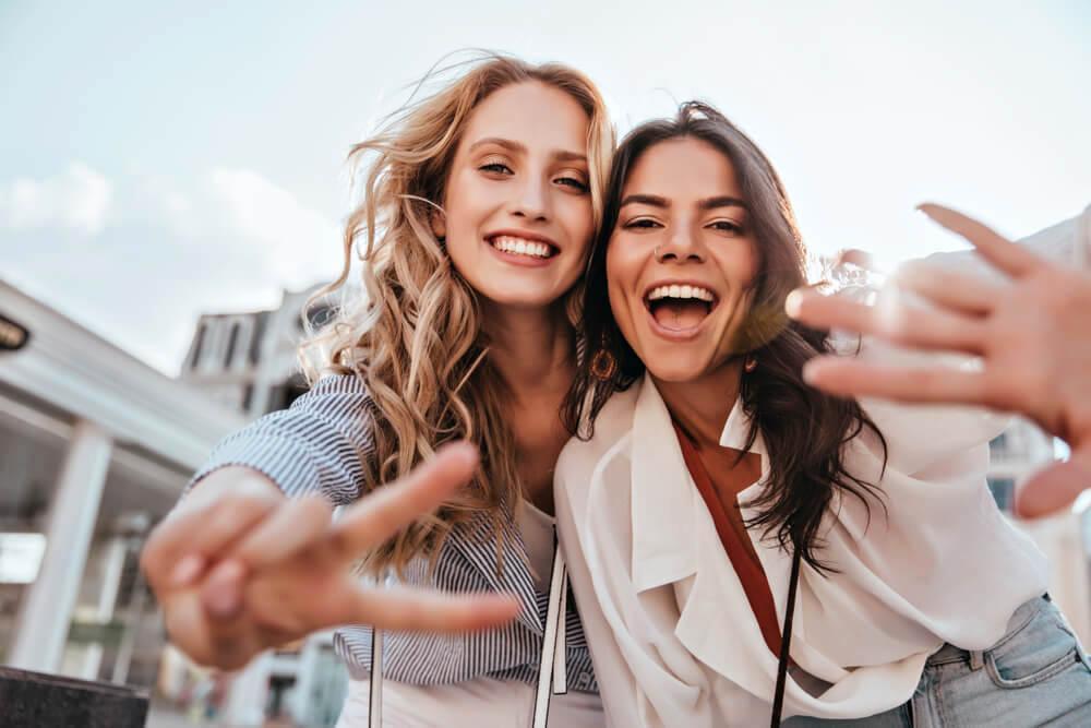 Two happy women friends taking a selfie