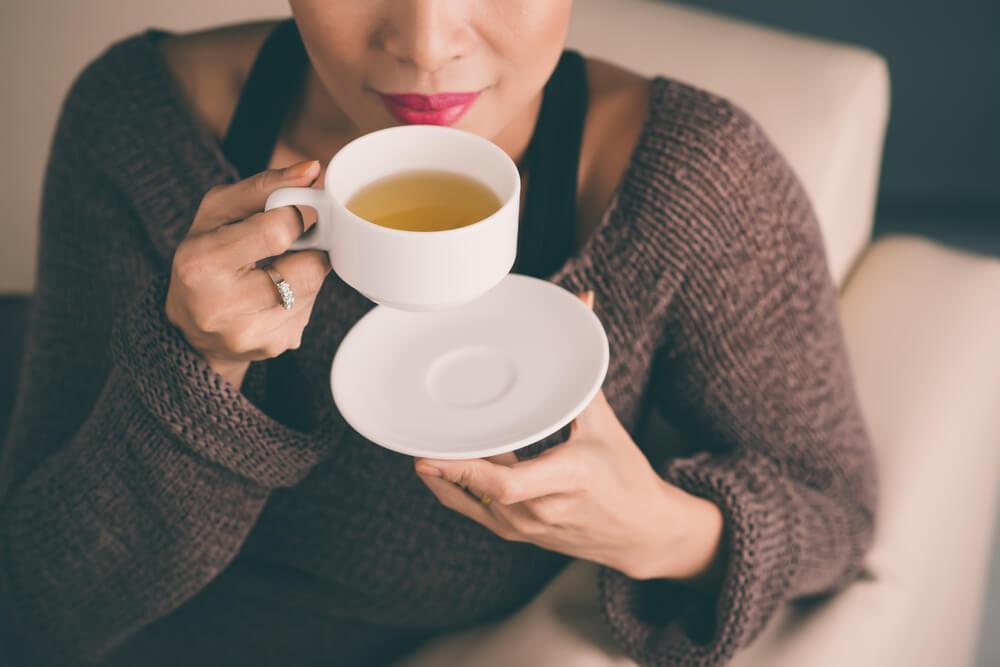 Woman drinking cup of tea