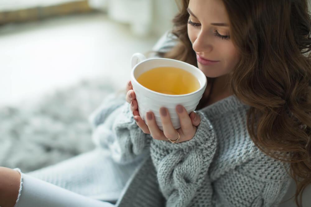 Woman drinking cup of tea