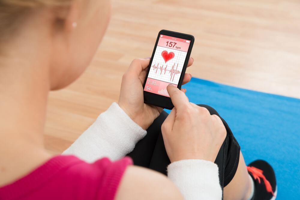 Woman looking at health app on phone