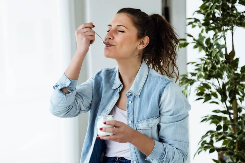 Woman eating yogurt