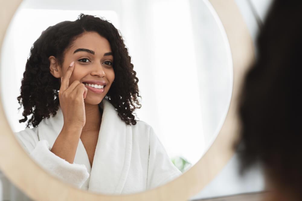 Woman pointing at skin