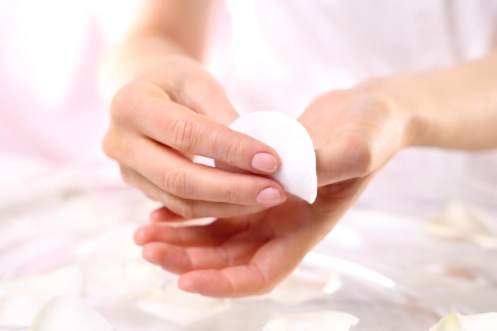 Woman removing nail polish