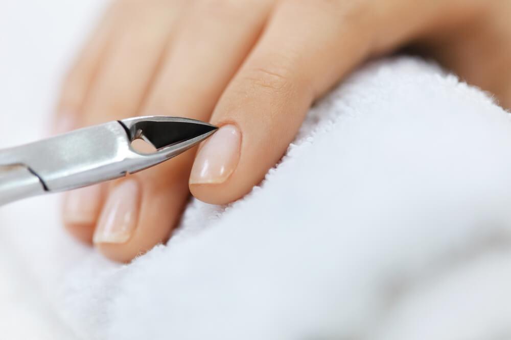 Cuticle care tool on nail