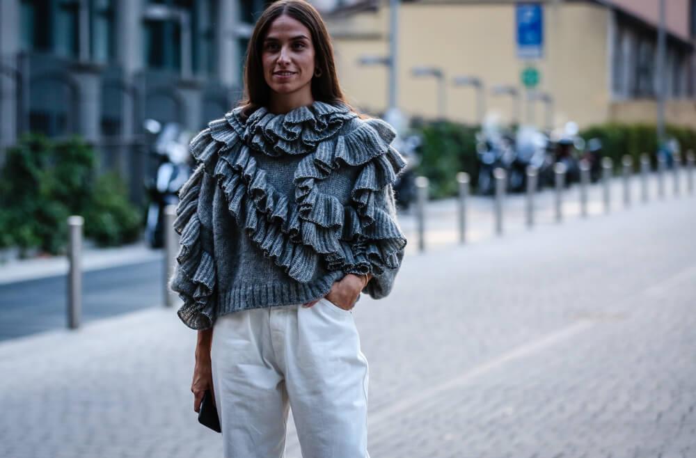 Woman wearing ruffled top