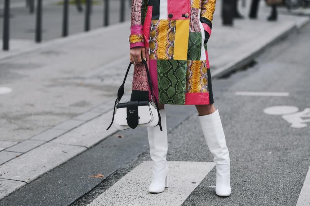 Woman wearing white boots