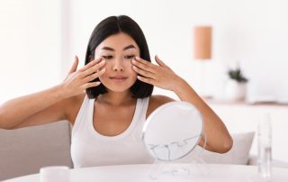 Woman massaging her face