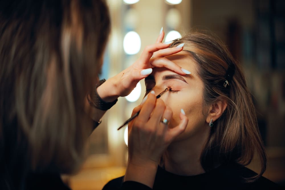 Makeup artist doing eye makeup