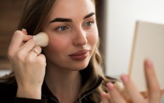 Woman applying foundation
